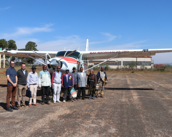 Translation team on Antsirabe Airstrip in front of MAF plane