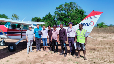 Real Mission Movement team on Soalala airstrip with MAF plane and pilot Ryan Unger