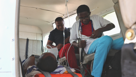 Doctor Herbert and Maka in MAF plane before departure