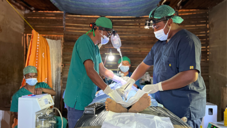 Surgeons performing surgery in MMS operations room