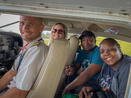 Mercy Ships Patient Selection Team on a MAF plane with pilot Ryan Unger in Madagascar for field consultation to assess patients.