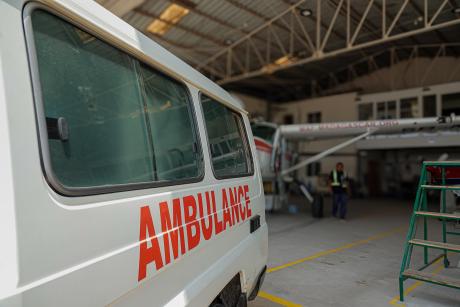 Ambulance with MAF plane in the background